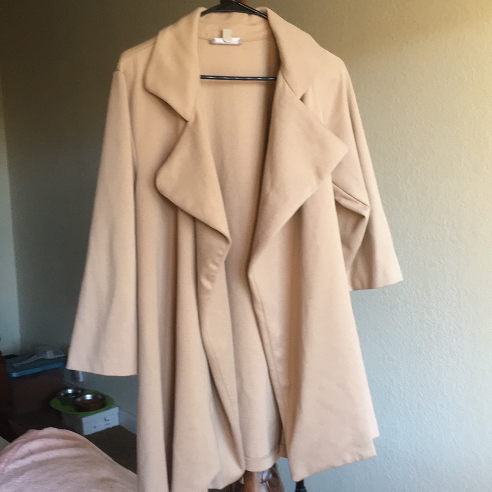 Joan Vas’s tan quarter sleeve wrap/sweater